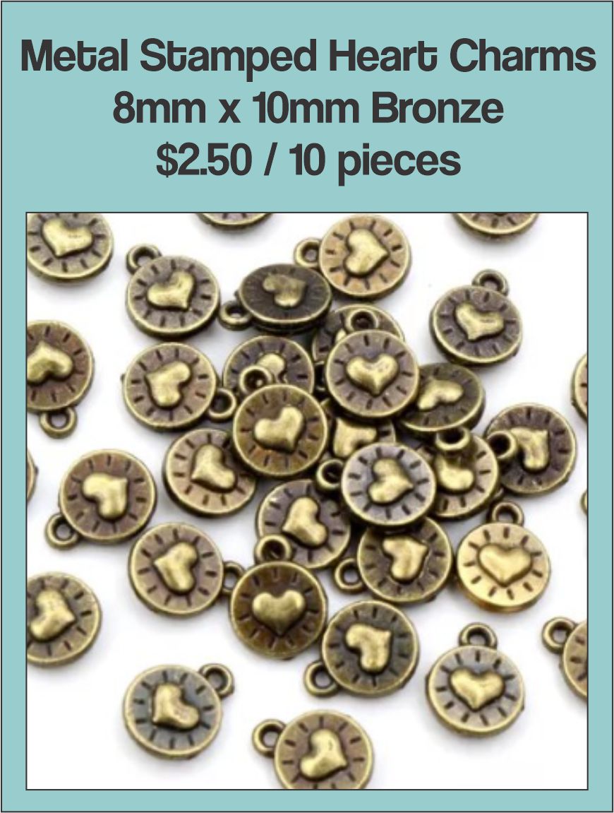 Pile of bronze-tone 8 x 10mm round charms stamped with a heart
