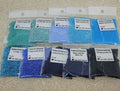 Ten 25g bags of Preciosa 11/0 seed beads in turquoise and blue shades, from pale aqua to navy