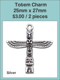 Silver-tone 25 x 27mm totem charm with outstretched wings on a labelled product card