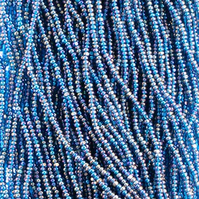 Close-up of strung Preciosa 13/0 true cut charlotte beads in transparent blue with an AB rainbow finish