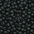 Close-up of Preciosa 11/0 Czech glass seed beads in transparent dark green