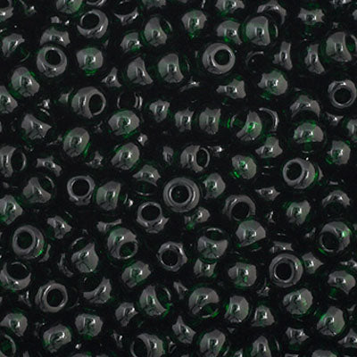 Close-up of Preciosa 11/0 Czech glass seed beads in transparent dark green