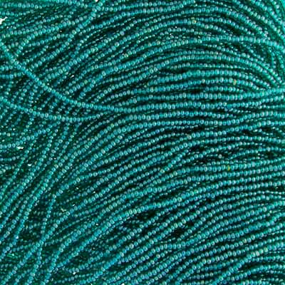 Close-up of strung Preciosa 13/0 true cut charlotte beads in transparent dark green with an AB rainbow finish