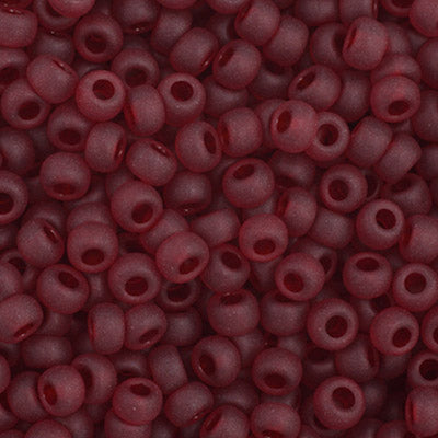 Close-up of Preciosa 11/0 Czech glass seed beads in transparent garnet matte