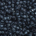 Close-up of Preciosa 11/0 Czech glass seed beads in transparent grey