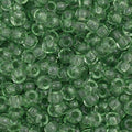 Close-up of Preciosa 11/0 Czech glass seed beads in transparent light green