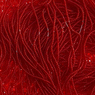 Close-up of strung Preciosa 13/0 true cut charlotte beads in transparent light red
