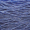 Close-up of strung Preciosa 13/0 true cut charlotte beads in transparent medium blue with a luster finish
