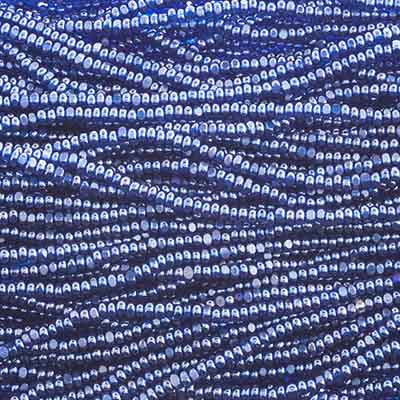 Close-up of strung Preciosa 13/0 true cut charlotte beads in transparent medium blue with a luster finish