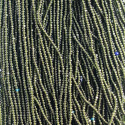 Close-up of strung Preciosa 13/0 true cut charlotte beads in transparent medium dark green