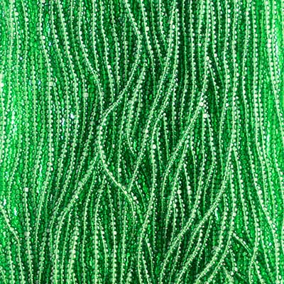 Close-up of strung Preciosa 13/0 true cut charlotte beads in transparent medium green