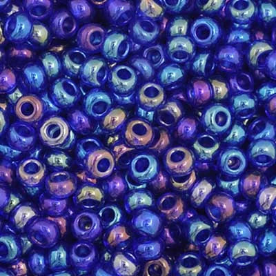 Close-up of Preciosa 11/0 Czech glass seed beads in transparent navy blue with an AB rainbow finish