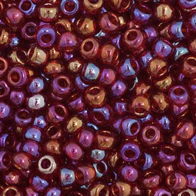 Close-up of Preciosa 11/0 Czech glass seed beads in transparent red with an AB rainbow finish