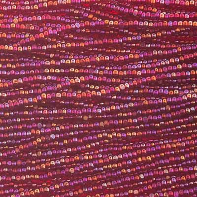 Close-up of strung Preciosa 13/0 true cut charlotte beads in transparent red with an AB rainbow finish