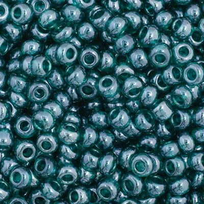 Close-up of Preciosa 11/0 Czech glass seed beads in transparent teal with a luster finish