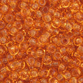 Close-up of Preciosa 11/0 Czech glass seed beads in transparent topaz