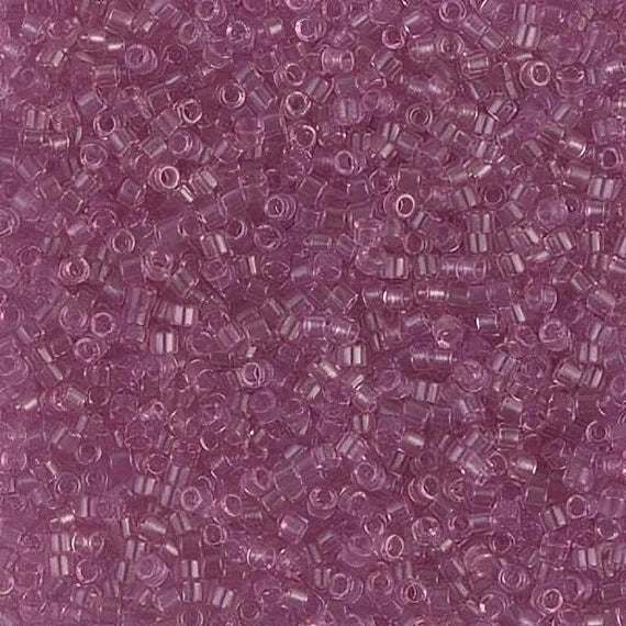 Close-up of Miyuki Delica 11/0 DB1413 cylinder beads in transparent light rose