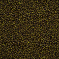 Close-up of Preciosa 11/0 Czech glass seed beads in opaque travertine on green