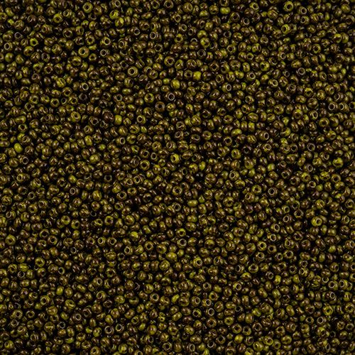 Close-up of Preciosa 11/0 Czech glass seed beads in opaque travertine on green