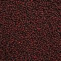 Close-up of Preciosa 11/0 Czech glass seed beads in opaque travertine on red