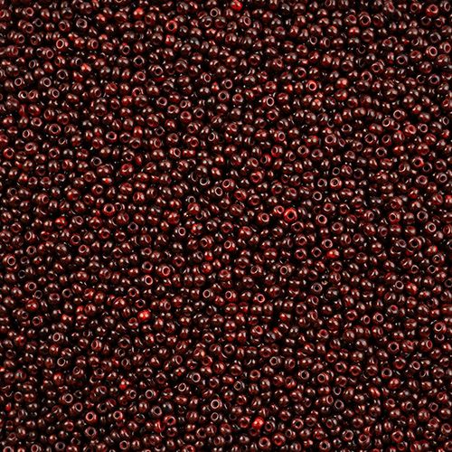 Close-up of Preciosa 11/0 Czech glass seed beads in opaque travertine on red