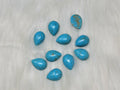 13 x 18mm dyed howlite turquoise drop cabochons (cabs) with dark veining, on white fur