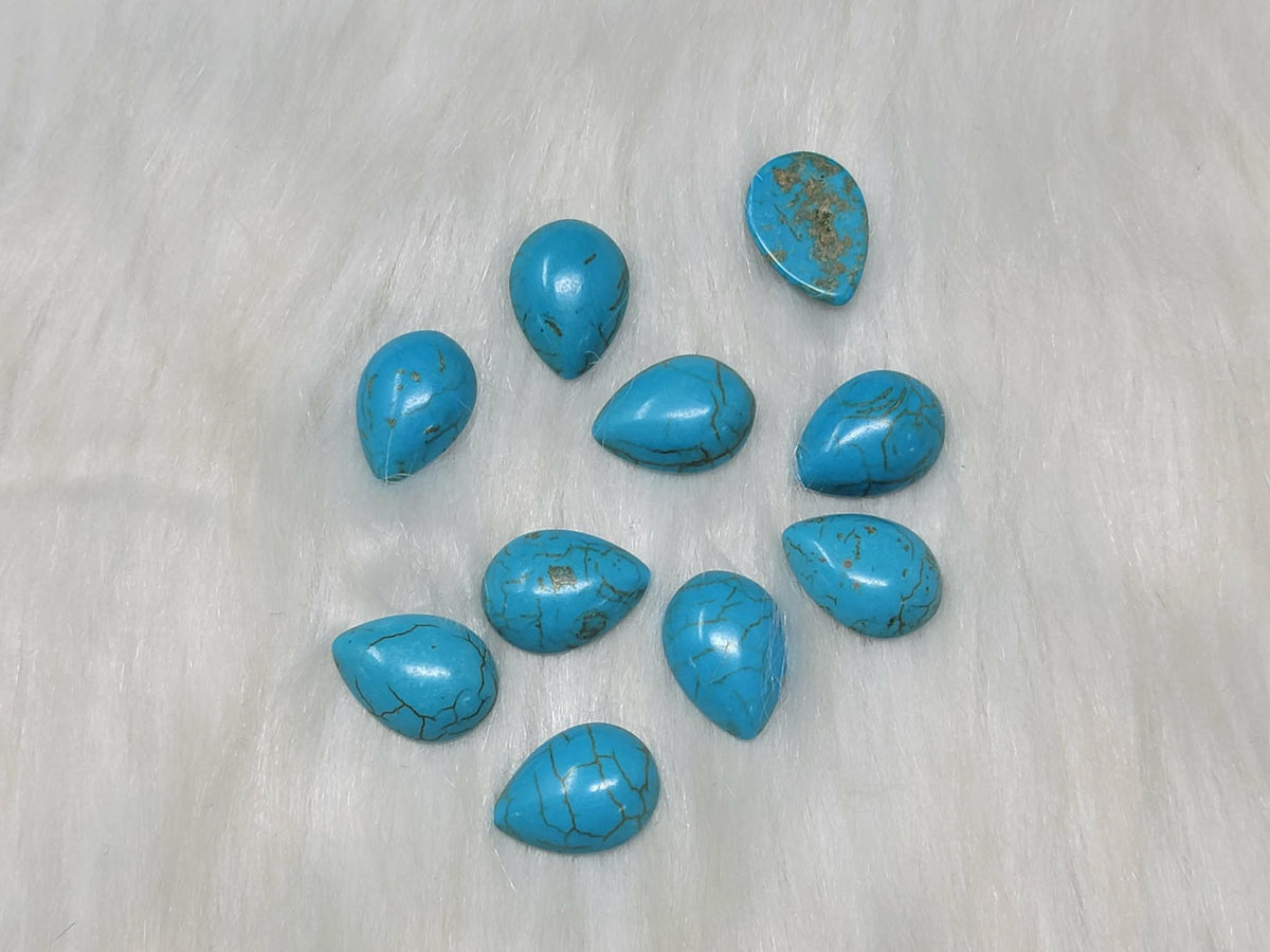 13 x 18mm dyed howlite turquoise drop cabochons (cabs) with dark veining, on white fur