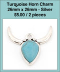 Silver-tone 26mm steer head charm with curved horns and a turquoise-coloured stone face