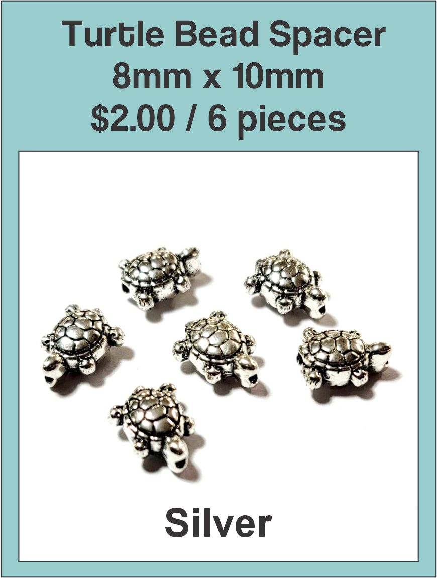 Silver-tone 8 x 10mm turtle spacer beads on a labelled product card