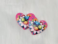 Pair of 37mm resin heart cabochons (cabs) in hot pink with a turquoise turtle on a large flower