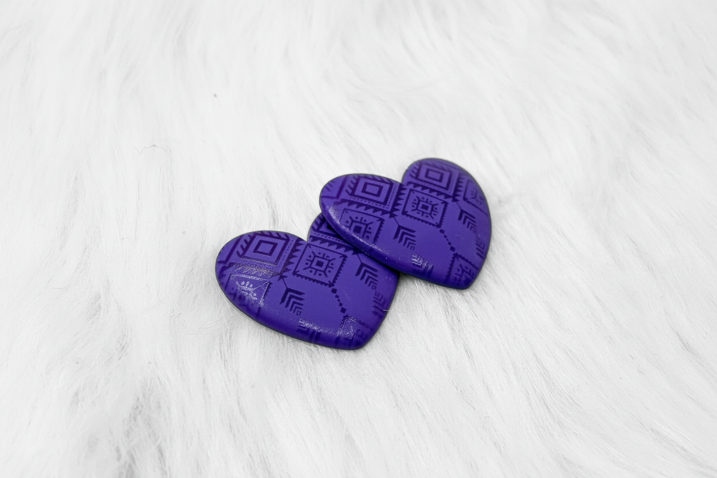 Pair of 37mm resin heart cabochons (cabs) in purple with an embossed geometric pattern
