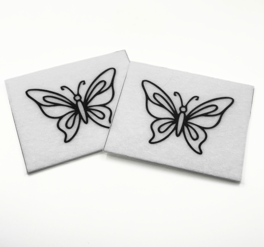 Two beading patterns printed in black on stiff white pellon squares, showing a detailed butterfly