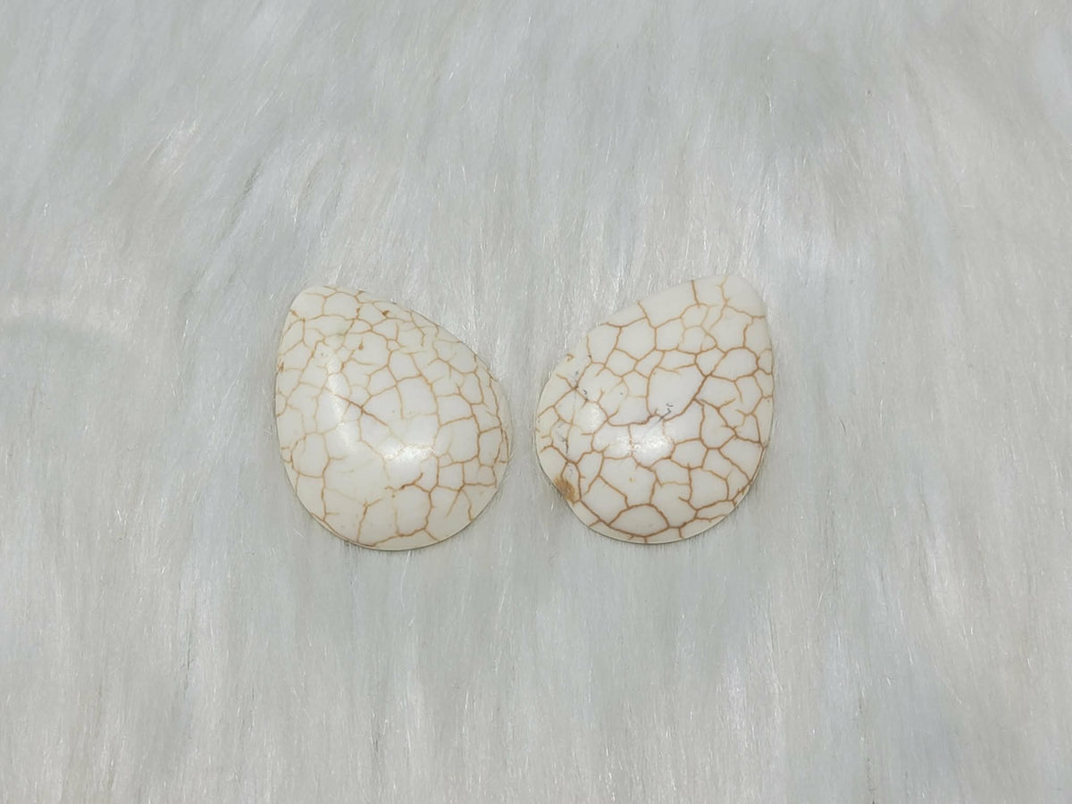 30 x 40mm dyed howlite white drop cabochons (cabs) with dark veining, on white fur