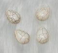 18 x 25mm dyed howlite white drop cabochons (cabs) with dark veining, on white fur