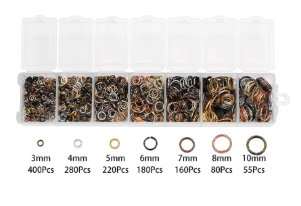 Clear divided case of assorted jump rings in seven sizes from 3mm to 10mm, with size labels