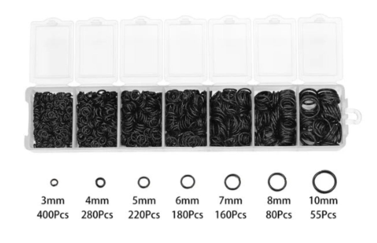 Clear divided case of black jump rings in seven sizes from 3mm to 10mm, with size labels