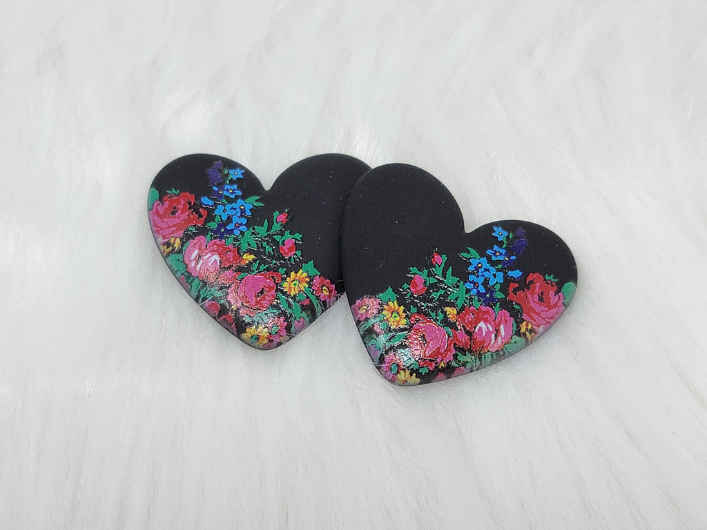 Pair of 37mm resin heart cabochons (cabs) in matte black with a kokum floral design of pink roses and blue flowers