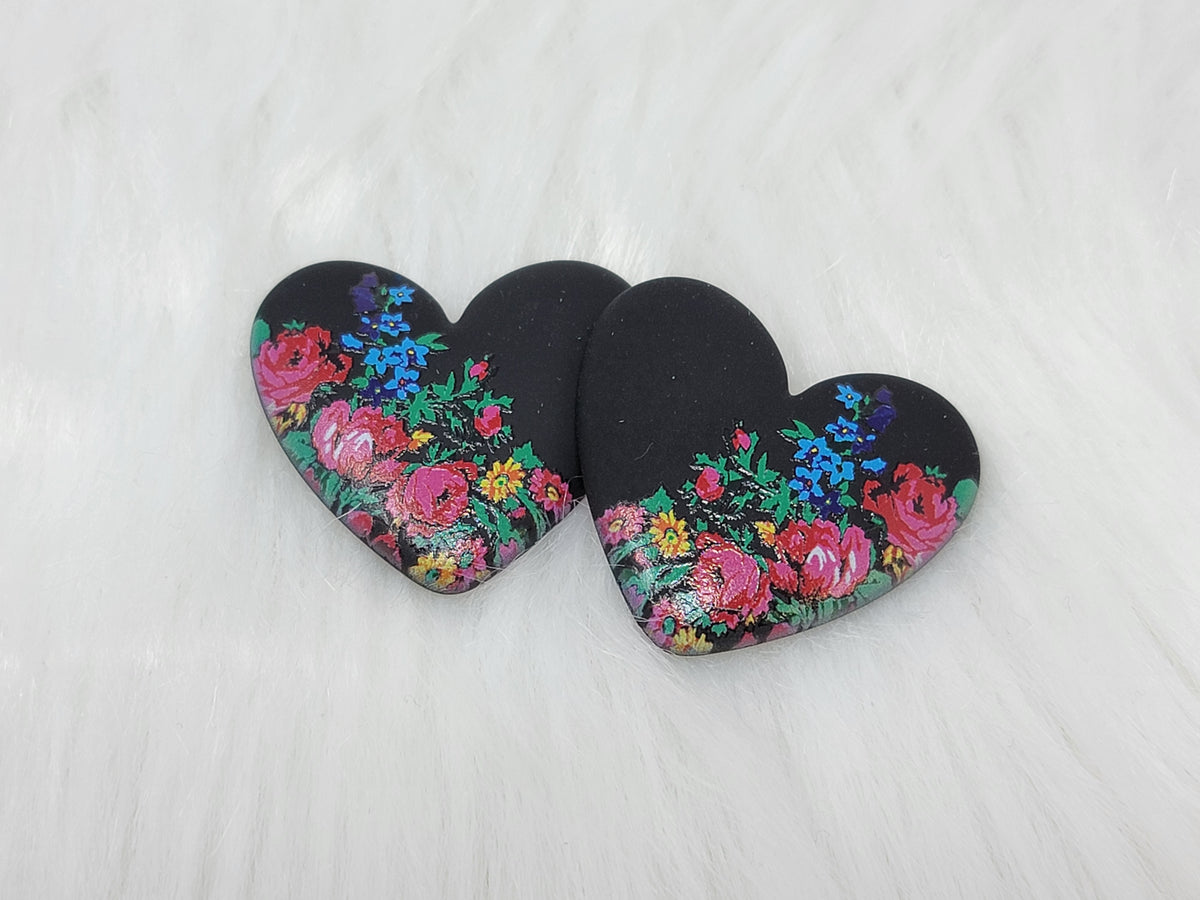 Pair of 37mm resin heart cabochons (cabs) in matte black with a kokum floral design of pink roses and blue flowers