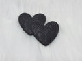 Pair of 37mm resin heart cabochons (cabs) in matte black with an embossed geometric pattern