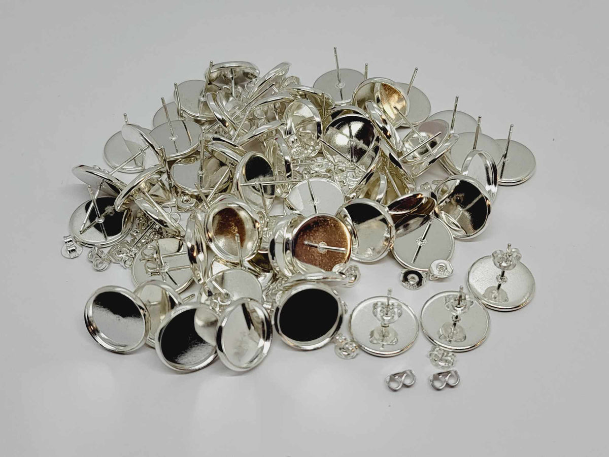 Pile of silver-plated stud post earrings with 12mm flat round pads