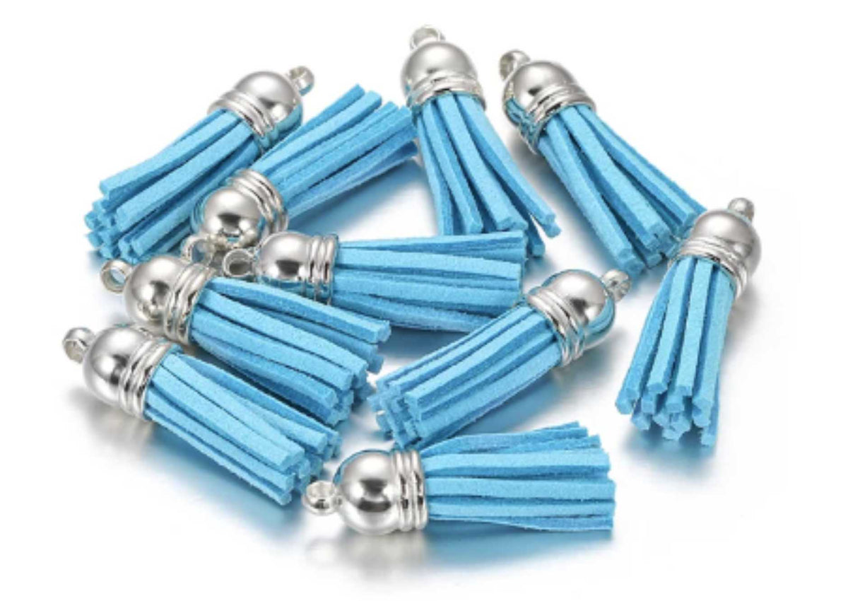 Pile of 38mm blue leather fringe tassels with silver-tone caps and loops