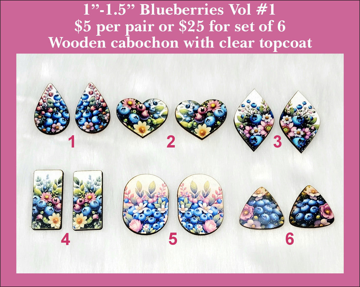 Six pairs of 1 to 1.5 inch cabochons (cabs) with blueberries and flowers in mixed shapes