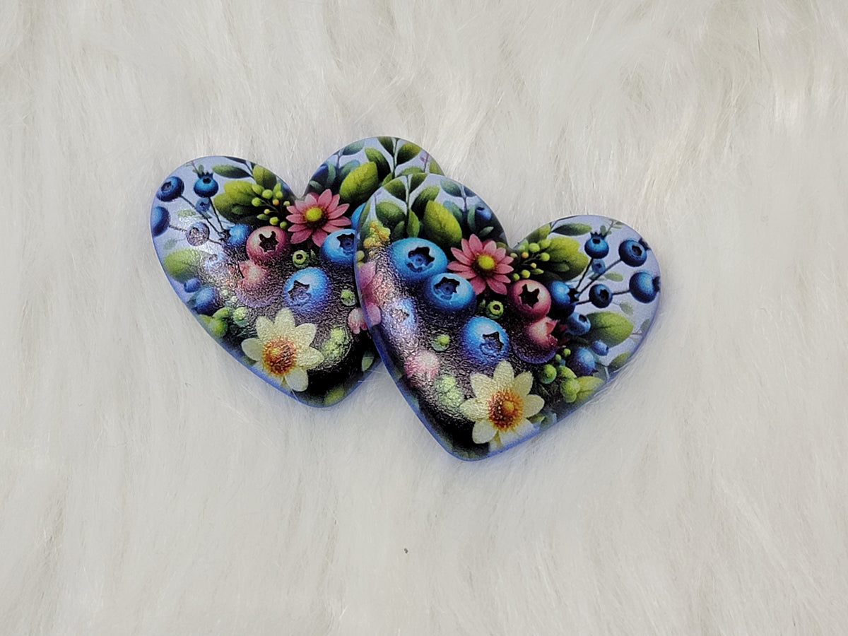 Pair of 37mm resin heart cabochons (cabs) in navy with blueberries and pastel flowers