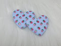 Pair of 37mm resin heart cabochons (cabs) in light blue with a red strawberry and white flower pattern