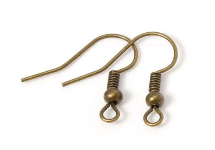 Pair of bronze shepherd earring hooks with coil and bead on a white background