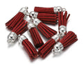 Pile of 38mm burgundy leather fringe tassels with silver-tone caps and loops