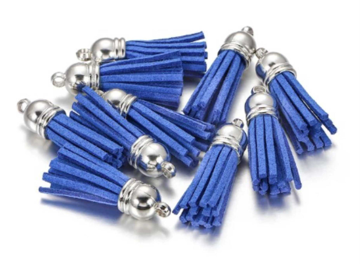 Pile of 38mm cobalt blue leather fringe tassels with silver-tone caps and loops