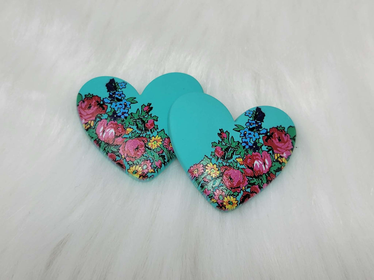 Pair of 37mm turquoise resin heart cabochons (cabs) with a kokum floral design of pink roses and blue flowers