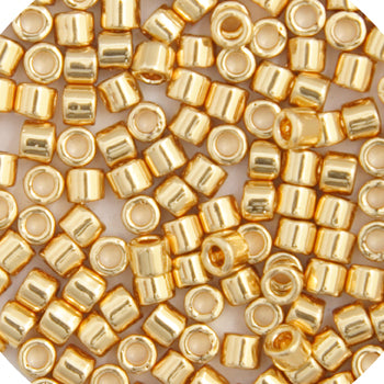 Close-up of Miyuki Delica 10/0 DBM0031 cylinder beads in 24kt gold plated transparent AB