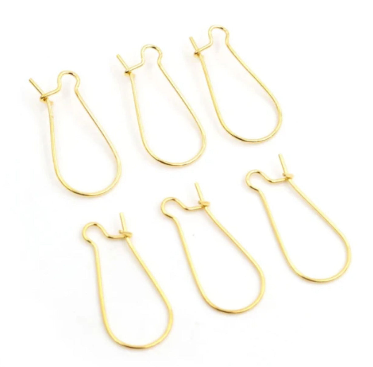 Group of gold kidney wire earring hooks in three sizes, laid out on a white background